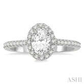 1 1/10 ctw Oval Halo Round Cut Diamond Engagement Ring With 3/4 ct Oval Cut Center Stone in 14K White Gold